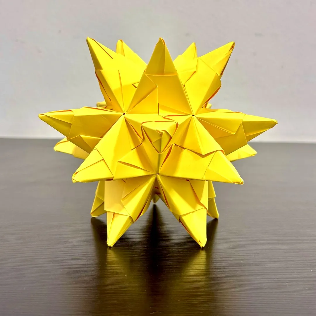 A yellow Bascetta Star, folded by hand from 30 modules